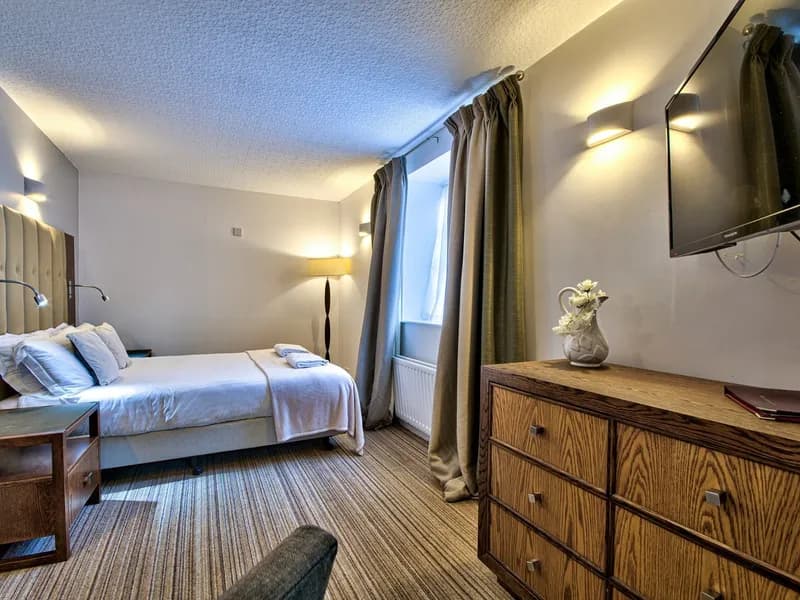 A deluxe room with a private balcony at The George at Piercebridge